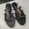 Saint Laurent Cassandra Slides Women Smooth Leather Black/Gold